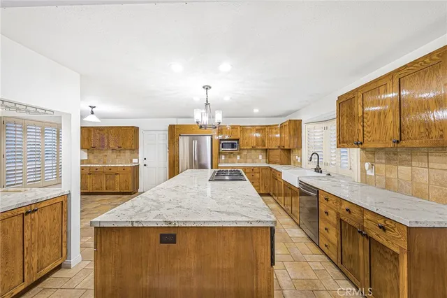 a large white kitchen with cabinets