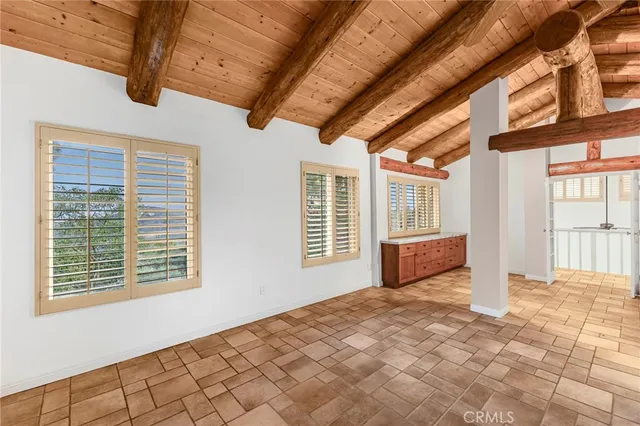 a spacious bathroom with a granite countertop sink and a large mirror
