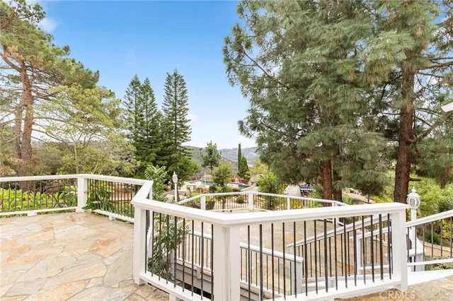 a view of a deck with two chairs and a table