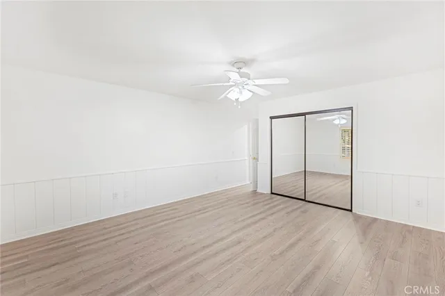 a view of an empty room with glass door