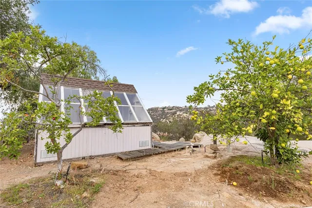 a view of a house with a yard and garage