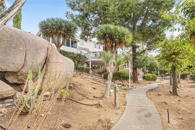 a view of a house with a large windows and stairs