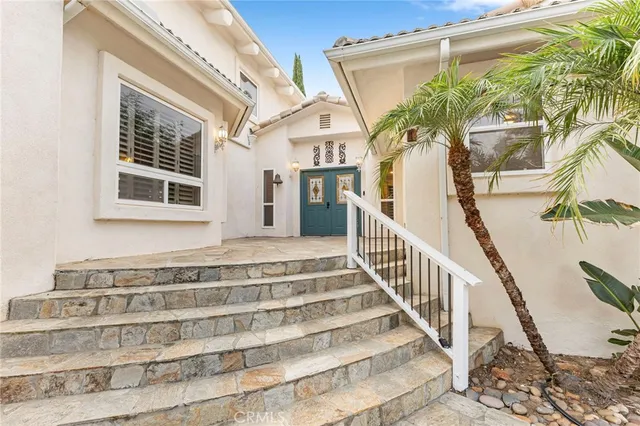 a bedroom with a bed and cabinets
