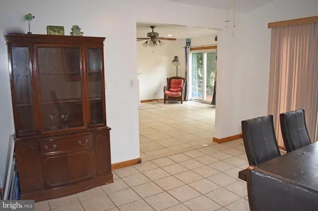 a view of kitchen with furniture and a refrigerator