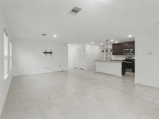 a view of a kitchen with a sink and a microwave