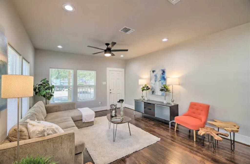 5224 Leeland Street Houston, TX 77023 - Photo 5 of 18 This roomy living area accommodates a full sectional or a sofa-and-loveseat setup, with space for additional furniture pieces.