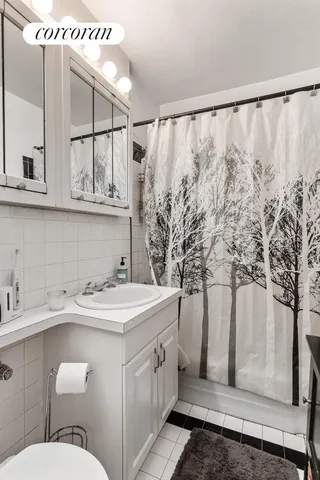 a view of a porch with wooden floor and a ceiling fan