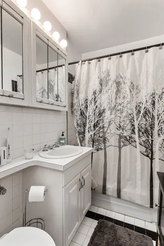 a bathroom with a sink and mirror