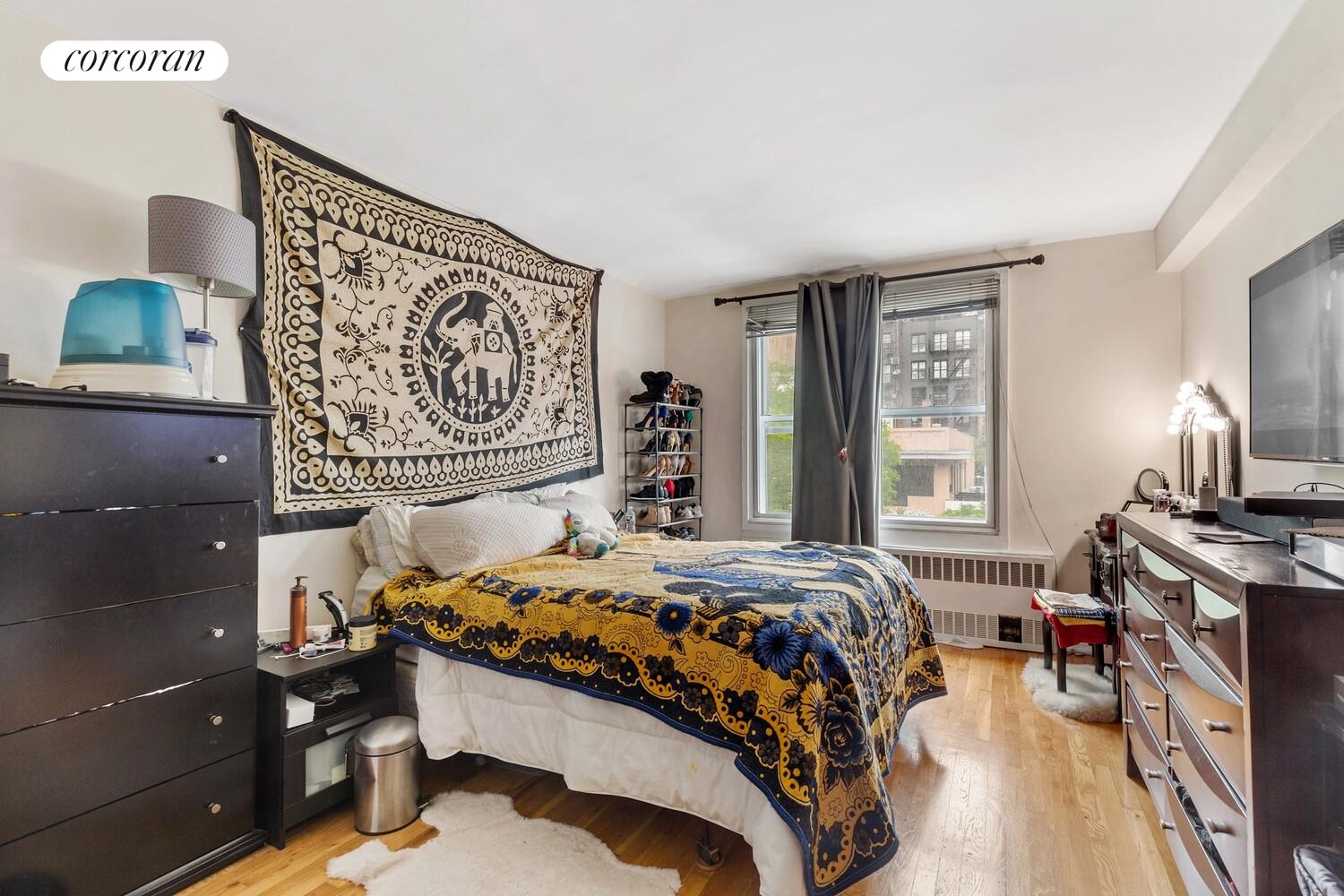 25 West 13th Street, Unit 3FN Manhattan, NY 10011 - Photo 14 of 20 a bedroom with a bed and a window