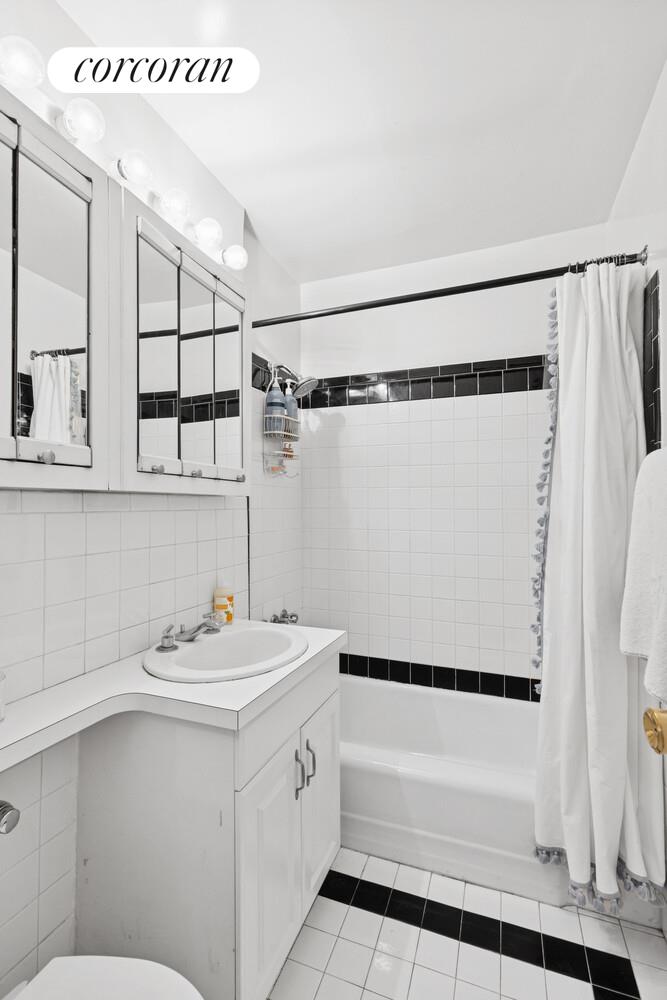 25 West 13th Street, Unit 3FN Manhattan, NY 10011 - Photo 6 of 20 a bathroom with a sink a toilet and shower