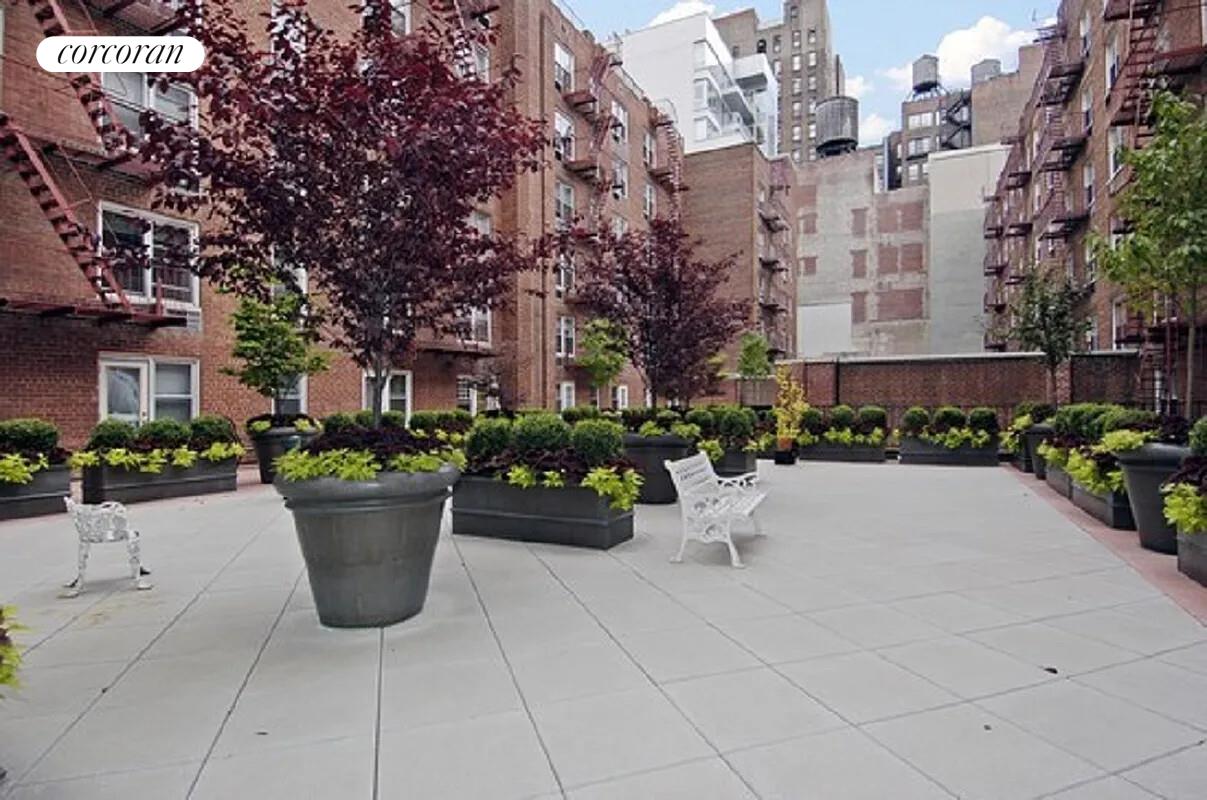 25 West 13th Street, Unit 3FN Manhattan, NY 10011 - Photo 8 of 20 a view of a terrace with chairs and potted plants