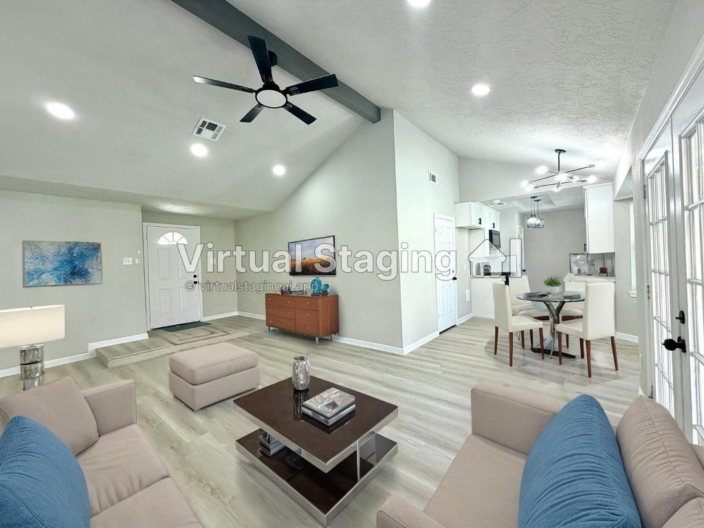 a living room with furniture and a table