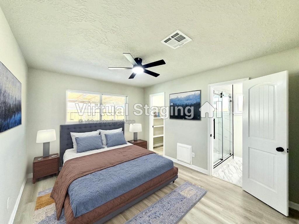 1710 Beaver Bend Road Houston, TX 77088 - Photo 15 of 32 a bedroom with a large bed and a window