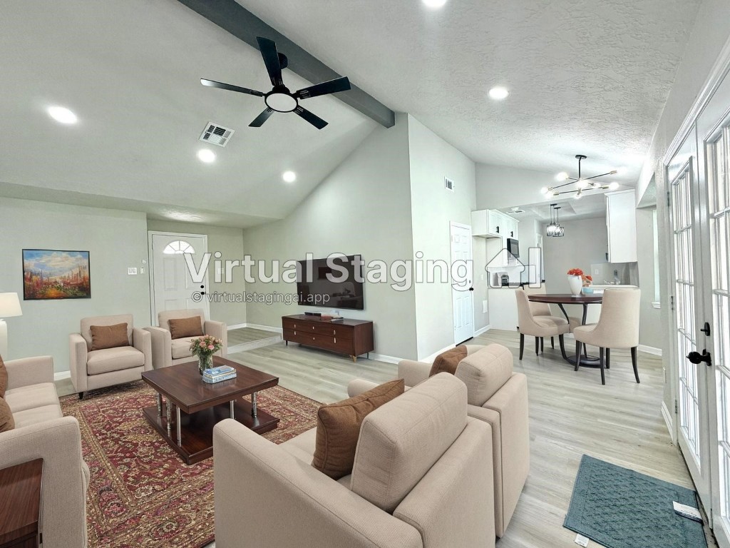 1710 Beaver Bend Road Houston, TX 77088 - Photo 2 of 32 a living room with furniture and a chandelier