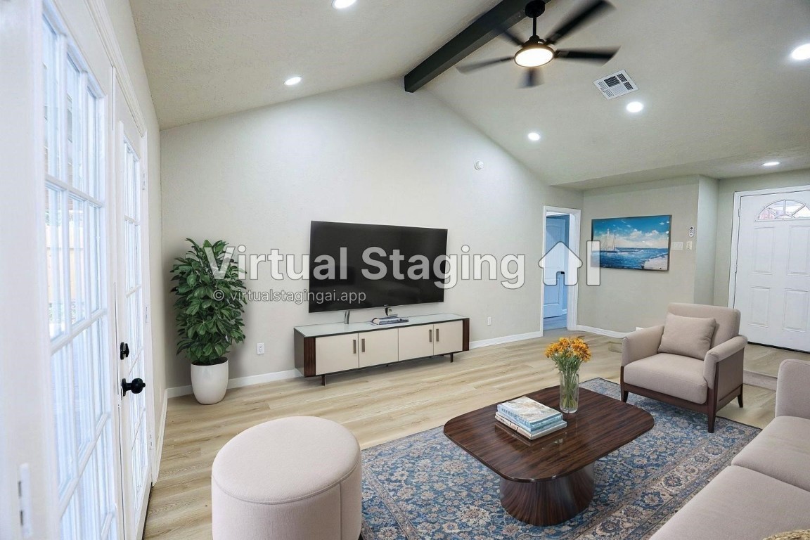 1710 Beaver Bend Road Houston, TX 77088 - Photo 8 of 32 a living room with furniture and a wooden floor
