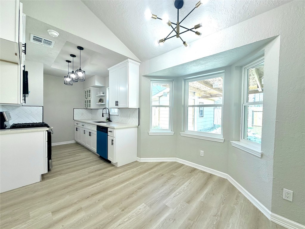 1710 Beaver Bend Road Houston, TX 77088 - Photo 9 of 32 a kitchen with a stove a sink and a refrigerator