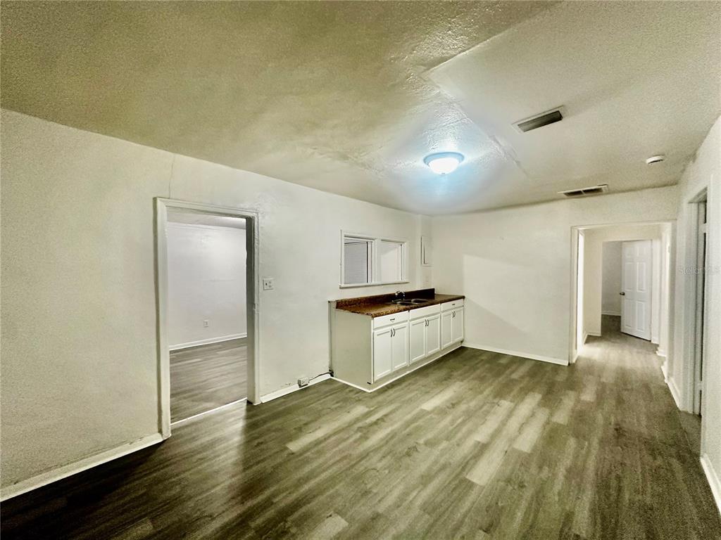 1907 Rio Grande Avenue Orlando, FL 32805 - Photo 8 of 17 a view of a kitchen with wooden floor