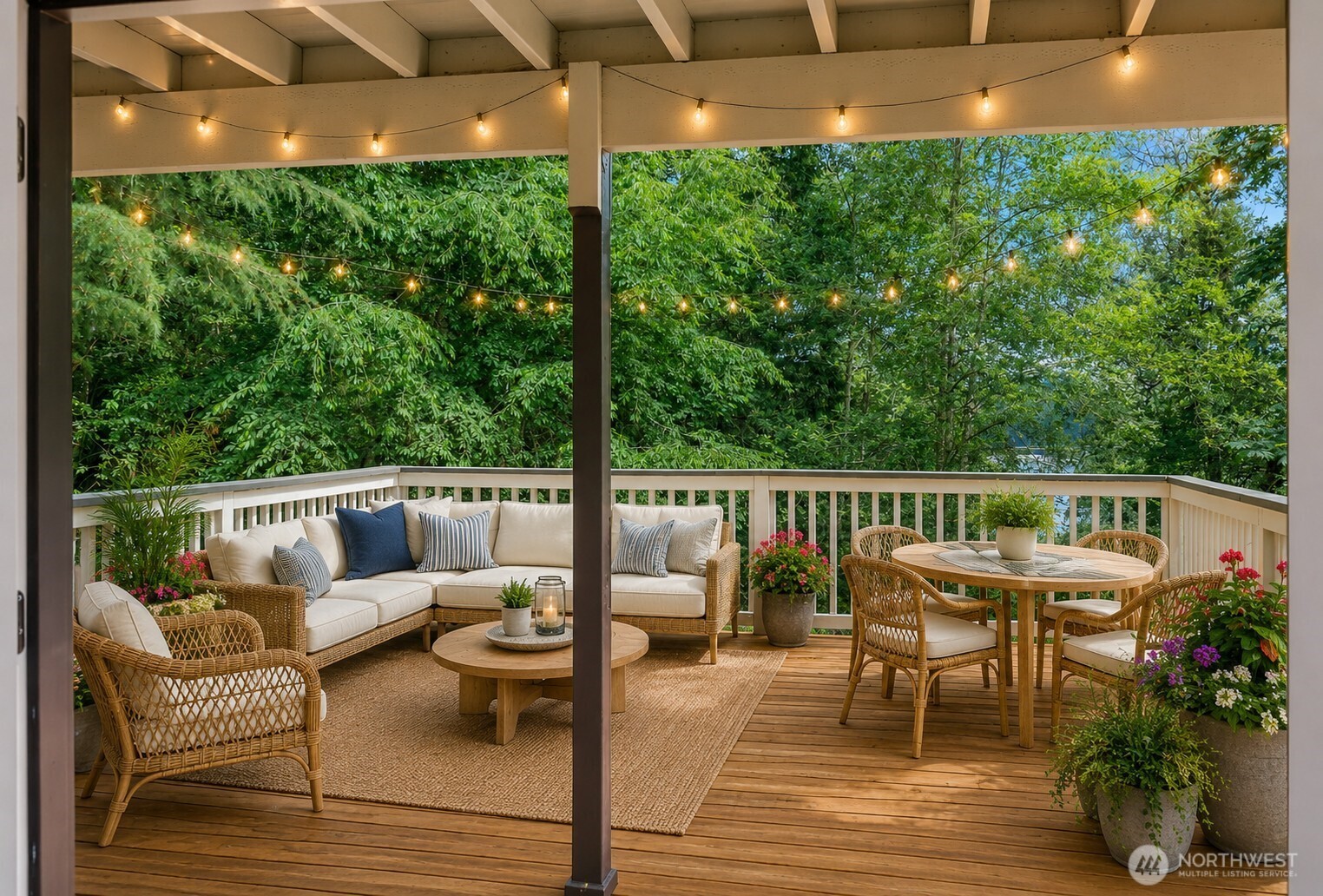 7605 Northeast Hidden Cove Road Bainbridge Island, WA 98110 - Photo 14 of 36 a balcony with wooden floor and outdoor seating