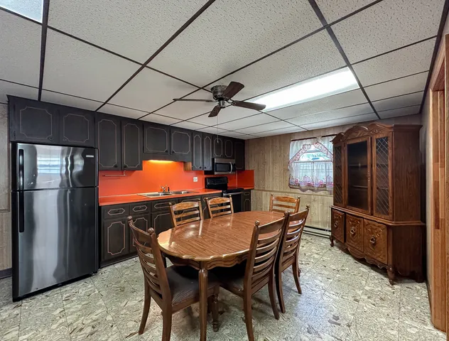 a dining room with furniture and window