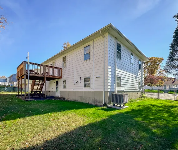 a front view of house with a garden
