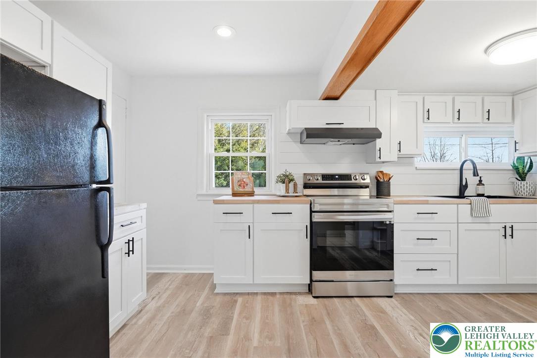 292 Walter Road Chalfont, PA 18914 - Photo 16 of 35 a kitchen with stainless steel appliances a stove a sink and a refrigerator