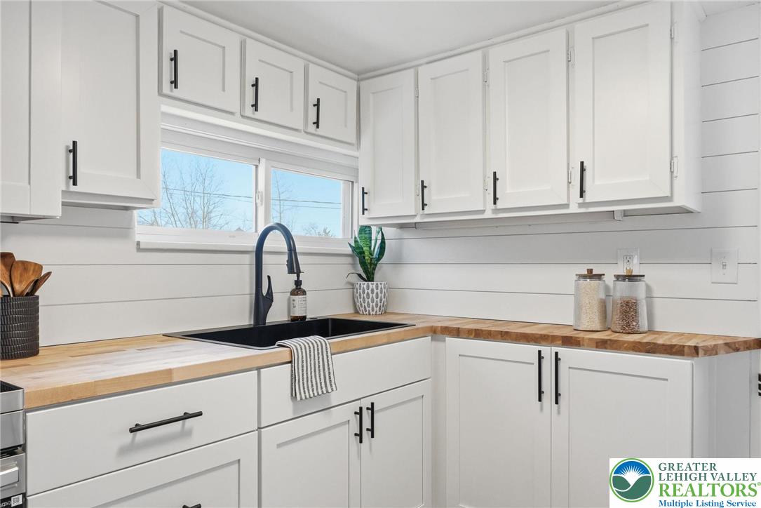 292 Walter Road Chalfont, PA 18914 - Photo 19 of 35 a kitchen with white cabinets and a sink