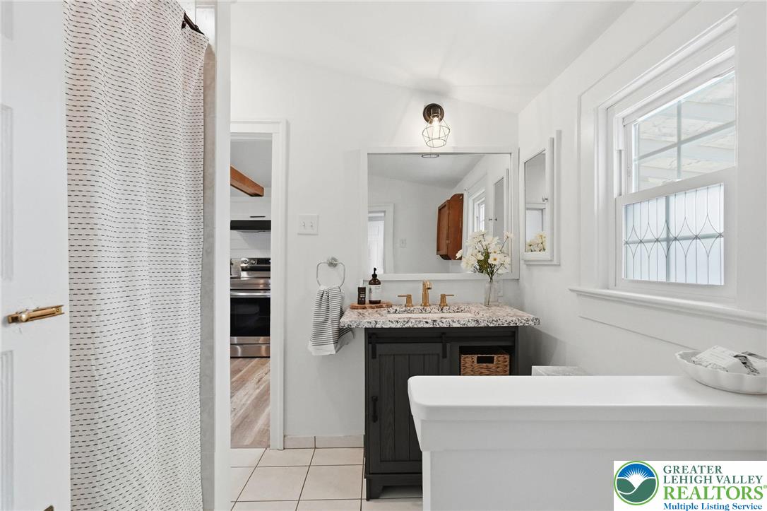 292 Walter Road Chalfont, PA 18914 - Photo 28 of 35 a bathroom with a sink a vanity and a mirror