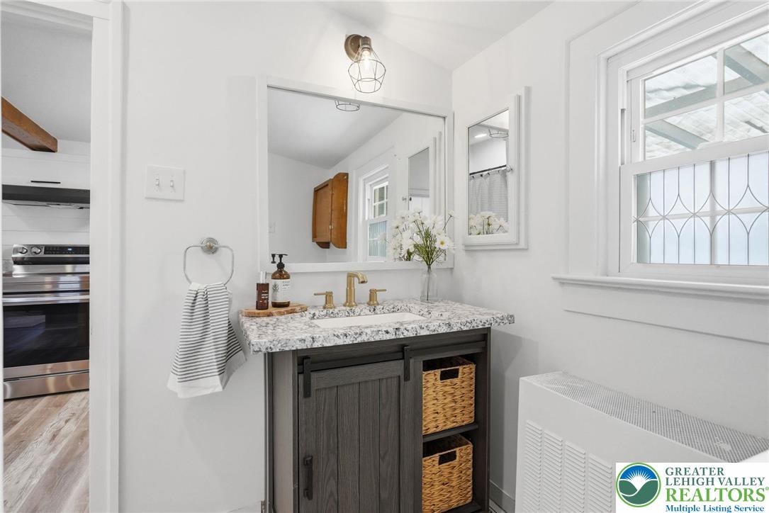 292 Walter Road Chalfont, PA 18914 - Photo 29 of 35 a bathroom with a granite countertop sink a mirror and a shower