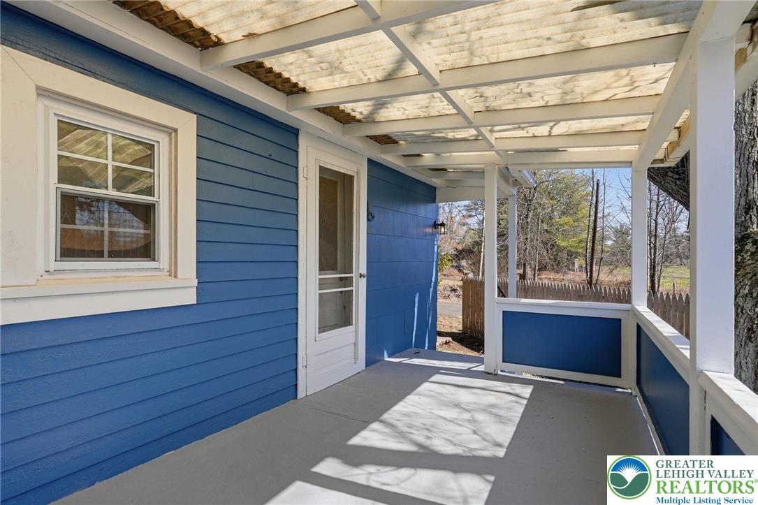292 Walter Road Chalfont, PA 18914 - Photo 33 of 35 a view of a porch with a refrigerator and wooden floor