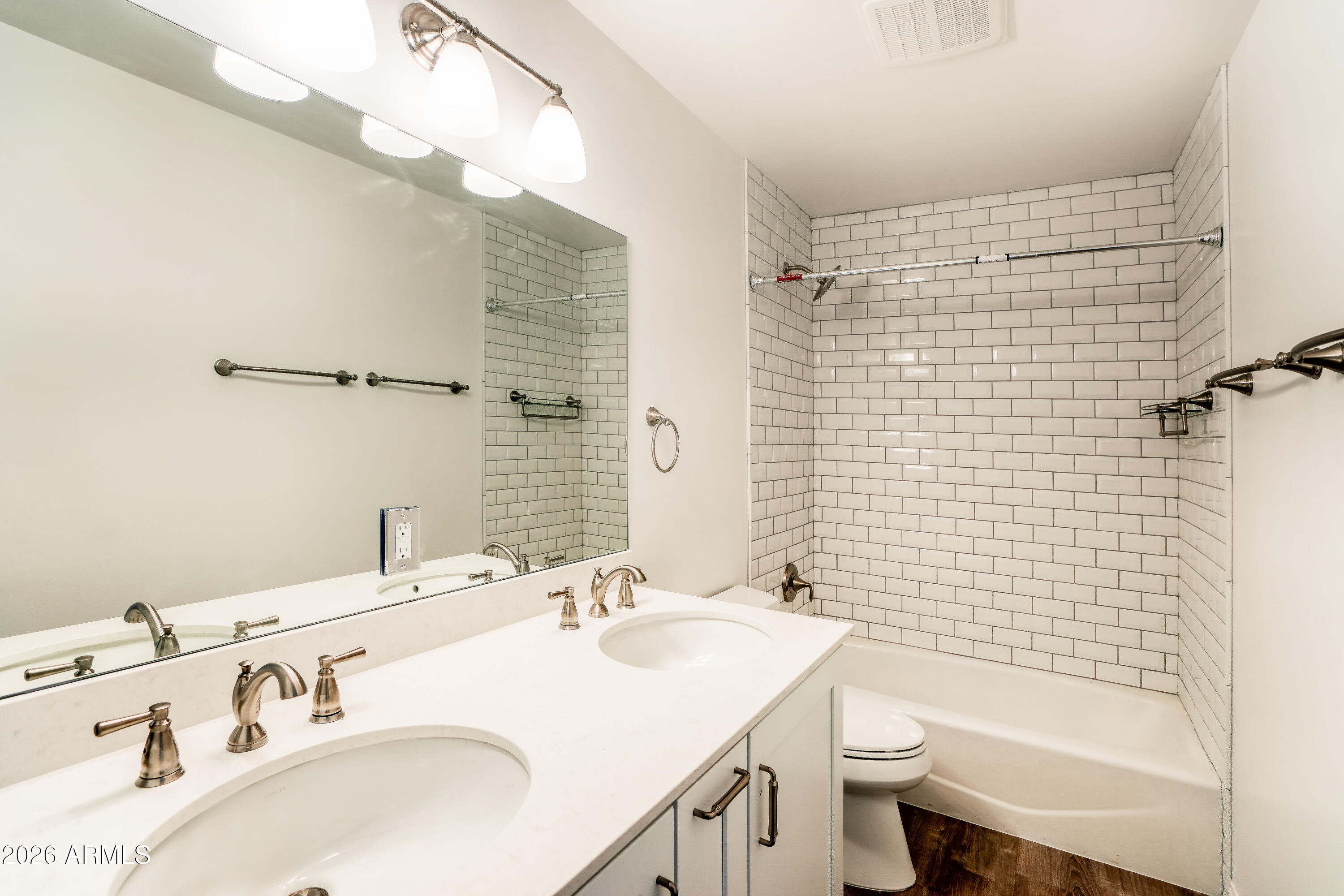 2226 East Devonshire Avenue Phoenix, AZ 85016 - Photo 11 of 17 a bathroom with a sink a toilet and shower