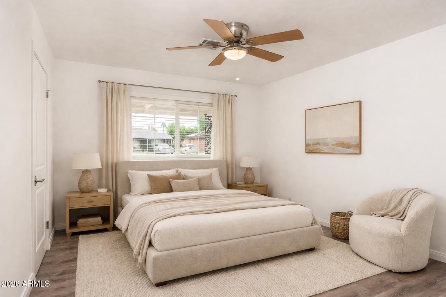 2226 East Devonshire Avenue Phoenix, AZ 85016 - Photo 12 of 17 a bedroom with a large bed and a couch