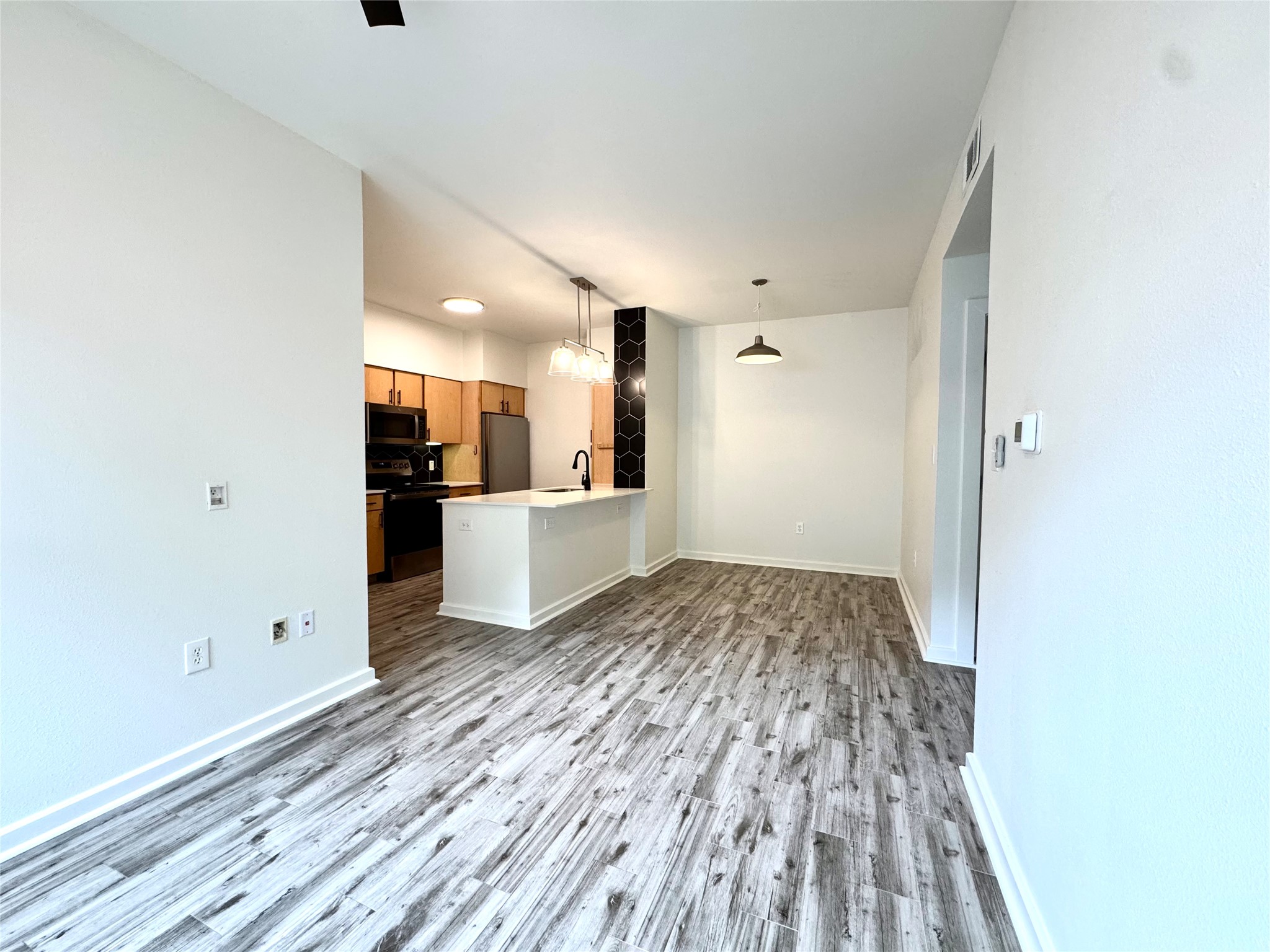 1201 Grove Boulevard, Unit 1701 Austin, TX 78741 - Photo 3 of 10 a view of empty room with wooden floor