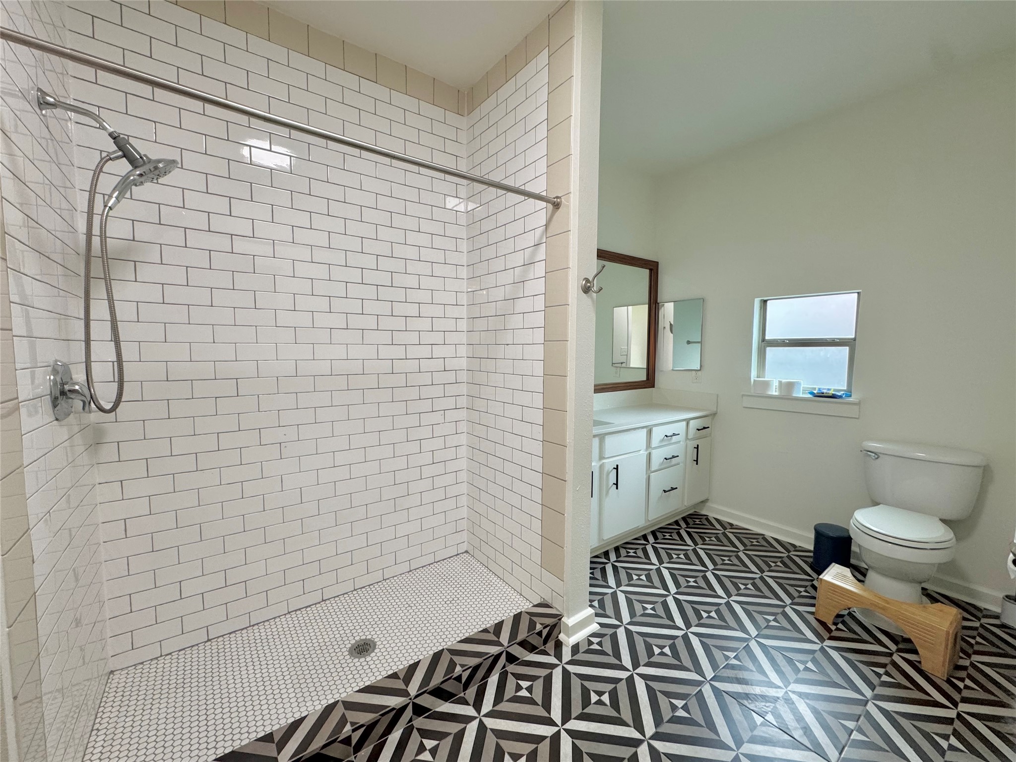 1201 Grove Boulevard, Unit 1701 Austin, TX 78741 - Photo 6 of 10 a bathroom with a sink toilet and shower