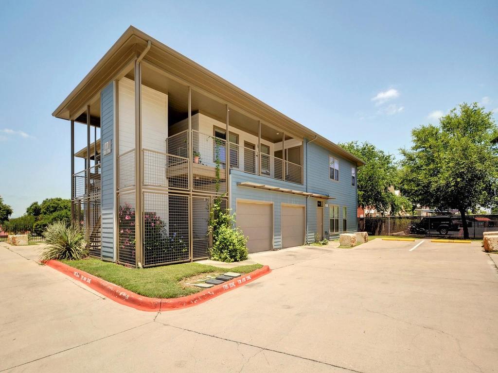 1201 Grove Boulevard, Unit 1701 Austin, TX 78741 - Photo 8 of 10 a front view of a house with a yard