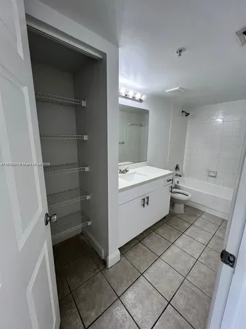 a bathroom with a double vanity sink and mirror