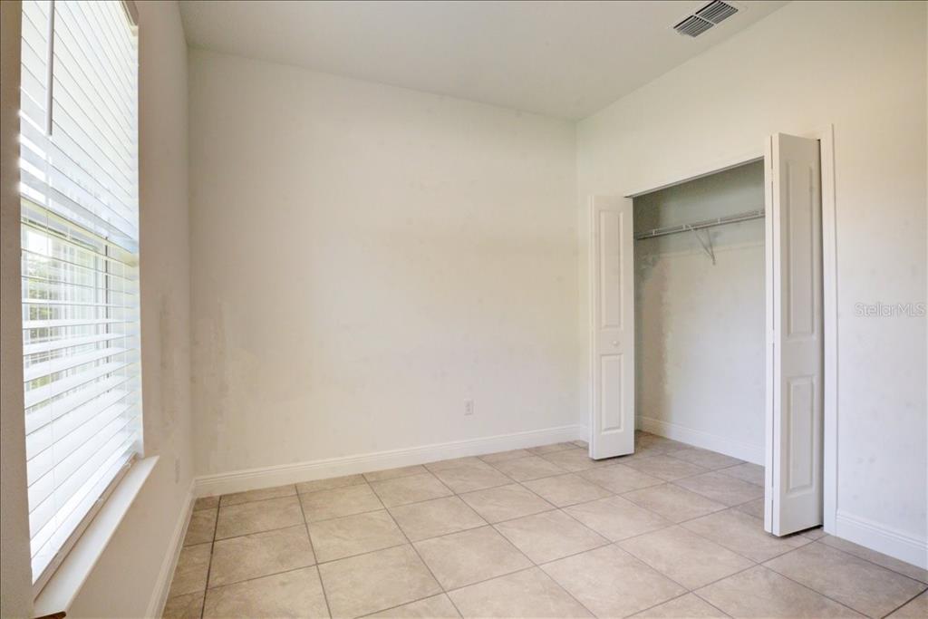 6952 Southwest 152nd Street Ocala, FL 34473 - Photo 12 of 25 a view of an empty room with a window