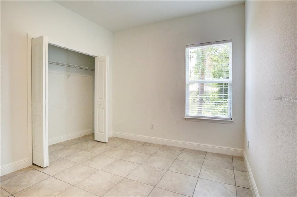 6952 Southwest 152nd Street Ocala, FL 34473 - Photo 16 of 25 an empty room with a window