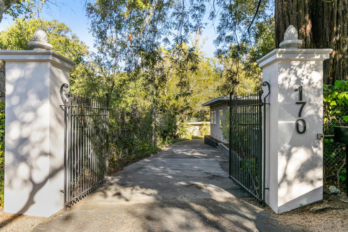 170 Bridge Road Hillsborough, CA 94010 - Photo 3 of 15 a view of a pathway of a house with a tree