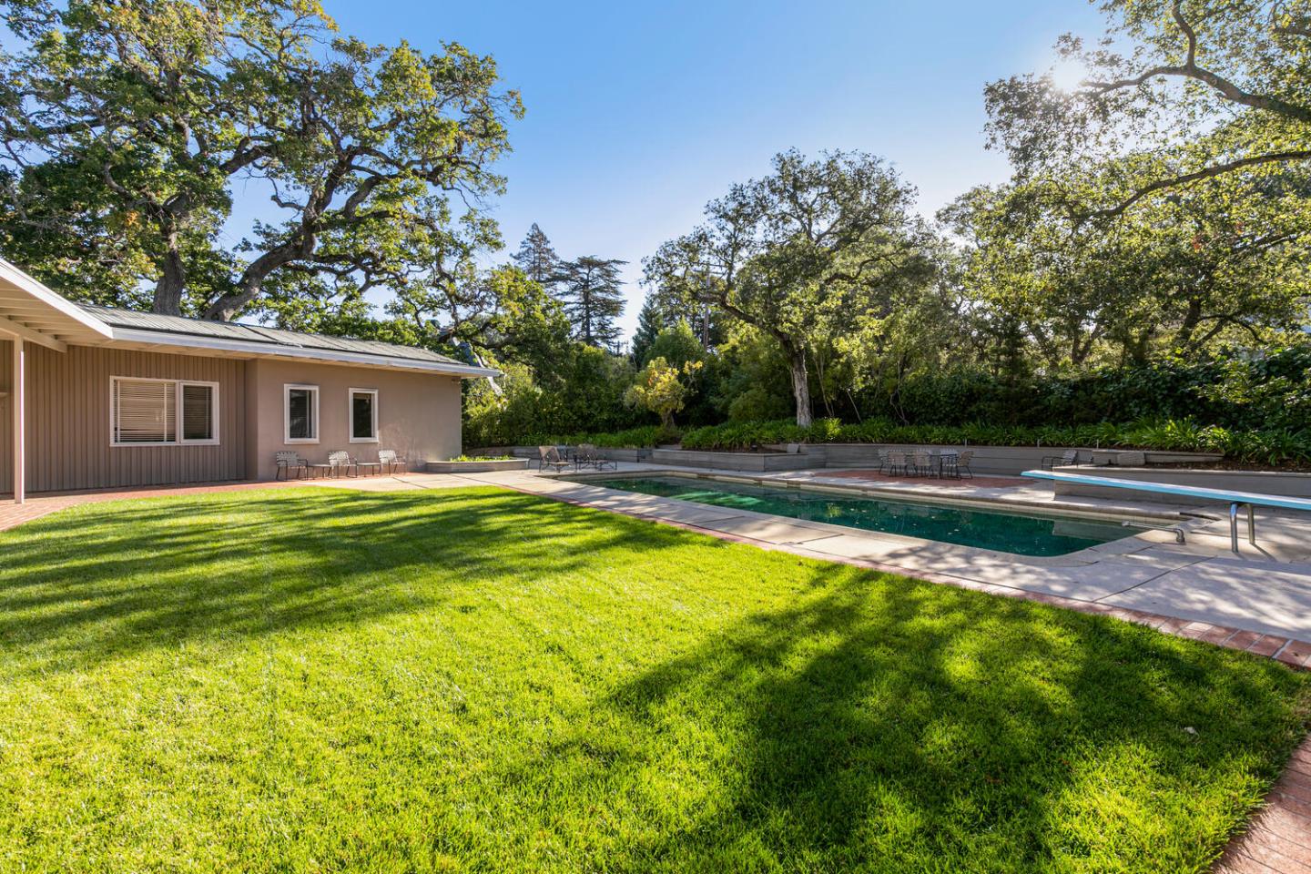 170 Bridge Road Hillsborough, CA 94010 - Photo 4 of 15 a view of a house with a swimming pool