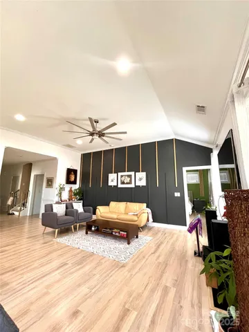 a bedroom with a bed window and couch