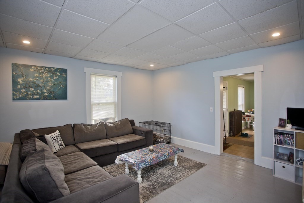 95 School Street Warren, MA 01083 - Photo 17 of 41 a living room with furniture and a flat screen tv