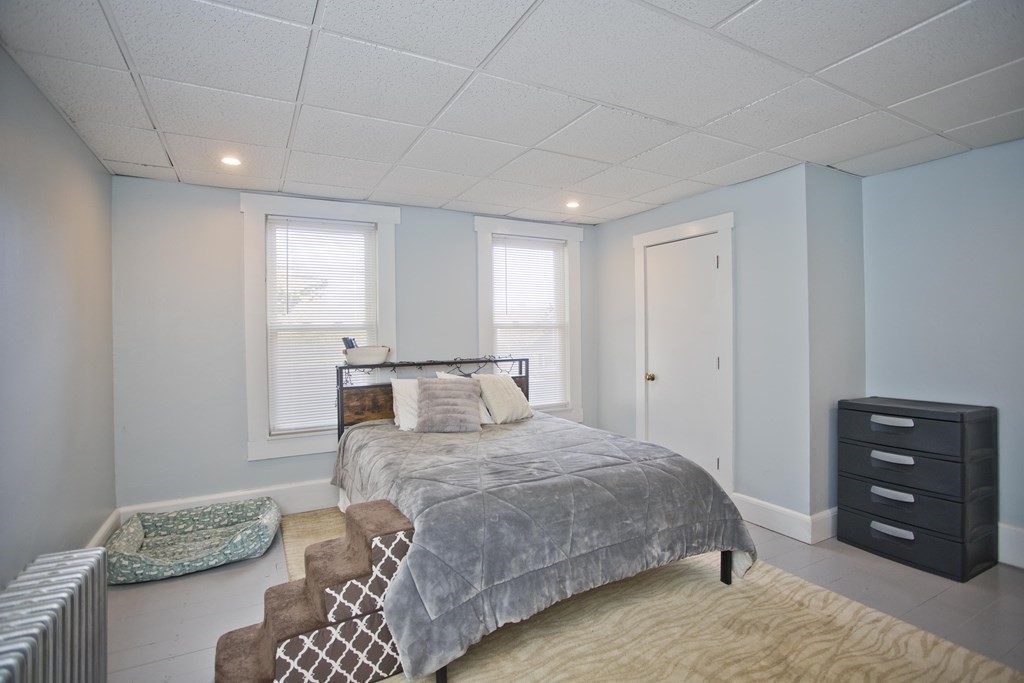 95 School Street Warren, MA 01083 - Photo 19 of 41 a bedroom with a bed and a dresser
