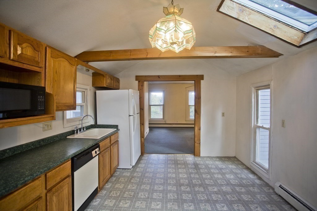 95 School Street Warren, MA 01083 - Photo 27 of 41 a kitchen that has a lot of cabinets and appliances
