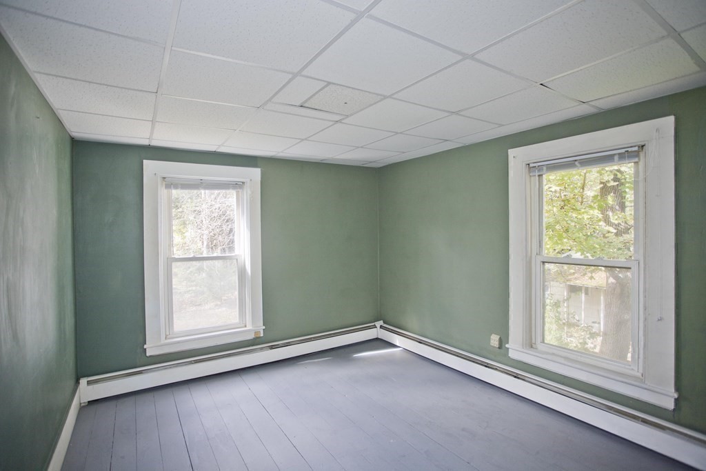 95 School Street Warren, MA 01083 - Photo 32 of 41 an empty room with wooden floor and windows