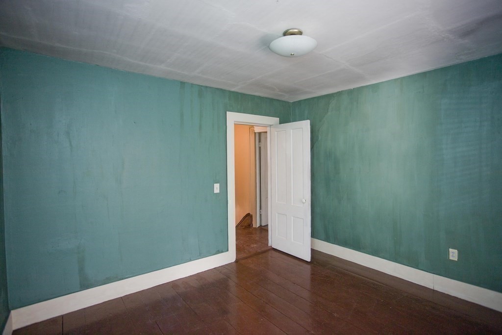 95 School Street Warren, MA 01083 - Photo 35 of 41 an empty room with wooden floor and closet