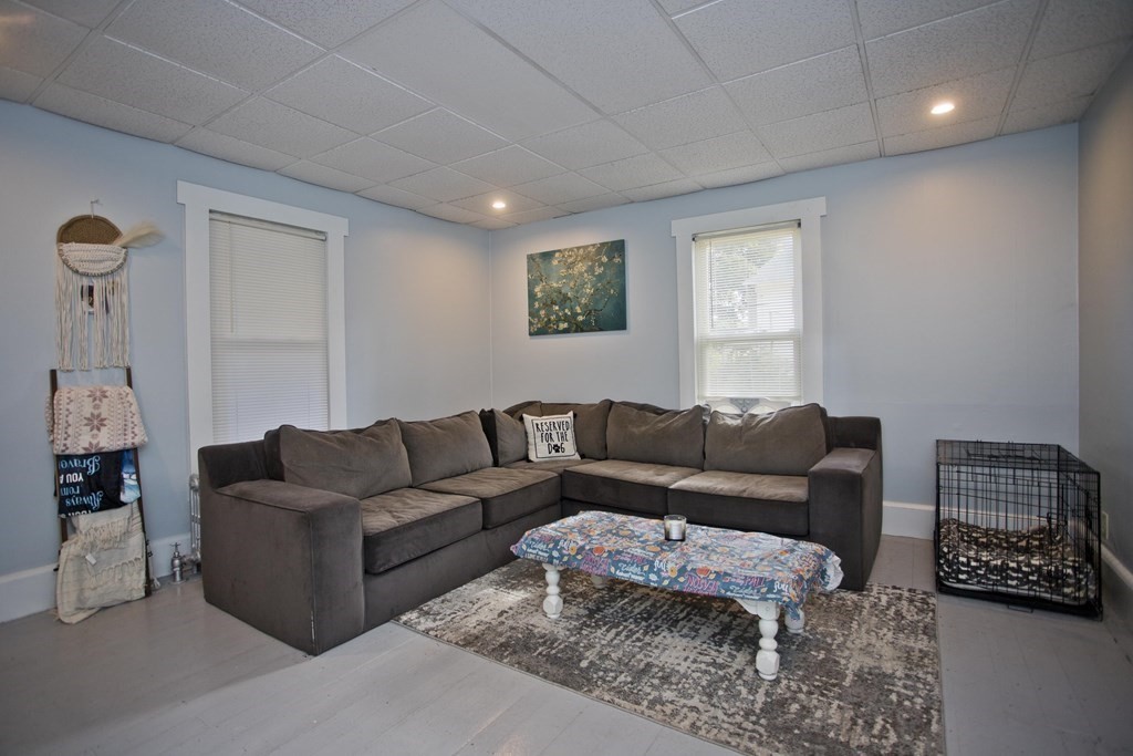 95 School Street Warren, MA 01083 - Photo 4 of 41 a living room with furniture a couch and a window