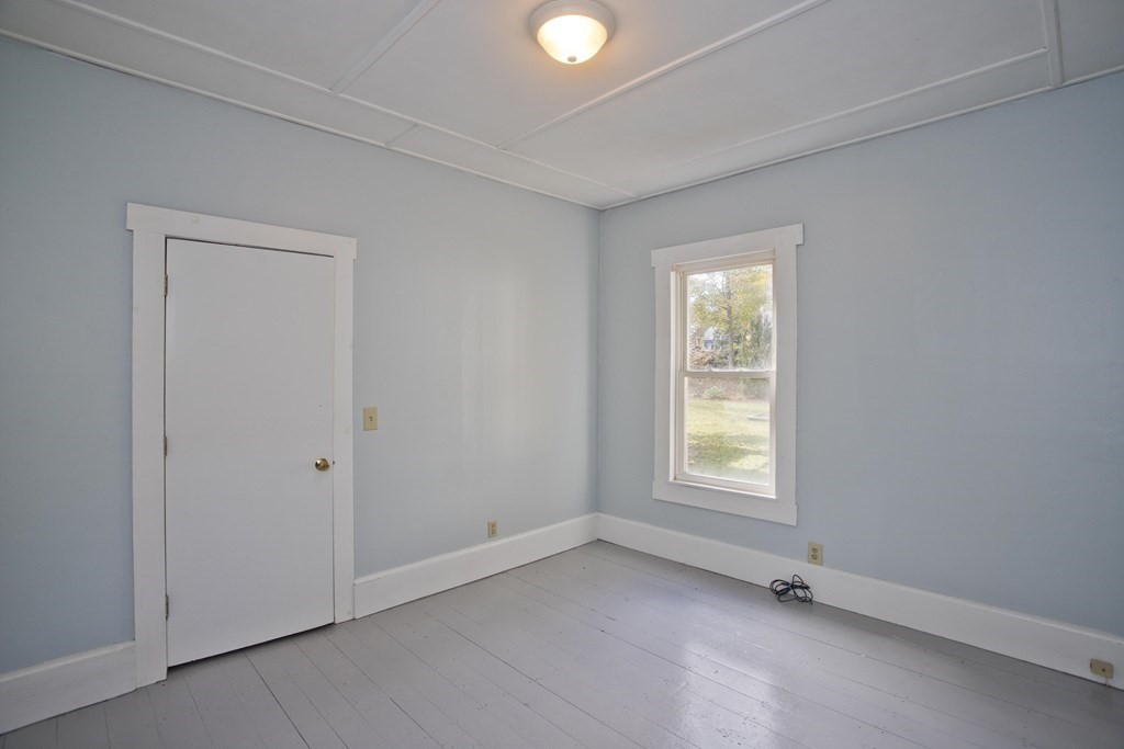95 School Street Warren, MA 01083 - Photo 7 of 41 an empty room with windows and closet