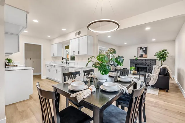 a kitchen with a table and chairs in it