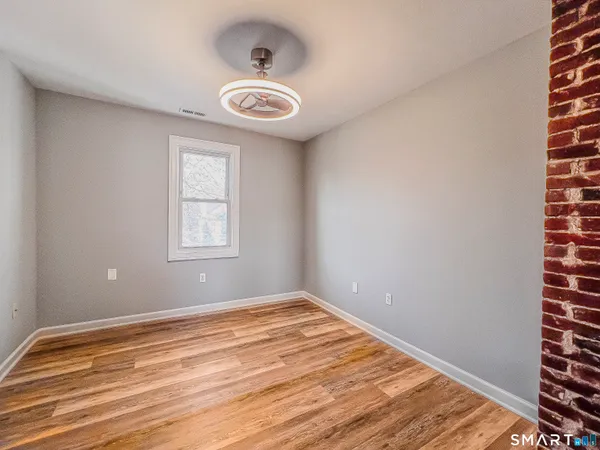 a view of a room that has a window in it