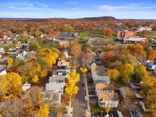 an aerial view of residential houses with outdoor space